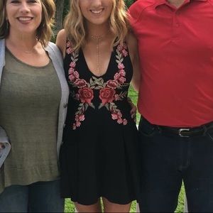 Black mini dress with red floral detail